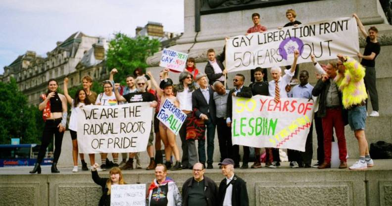Members of the Gay Liberation Front (GLF) hold up signs during a protest in 2019