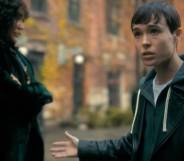 A screenshot from the trailer for Umbrella Academy season three in which Elliot Page's character Viktor talks to someone off screen and holds up their arm