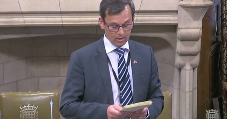 Nick Fletcher, Conservative MP for Don Valley, wears a grey suit jacket, white shirt and blue striped tie during a parliament debate