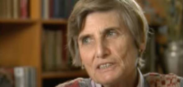 Margot Heuman, a Holocaust survivor, looks off screen as she talks to the person on the other side of the camera