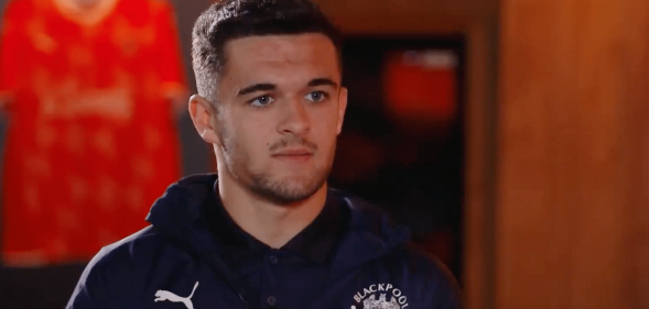 Blackpool footballer Jack Daniels sitting in a changing room