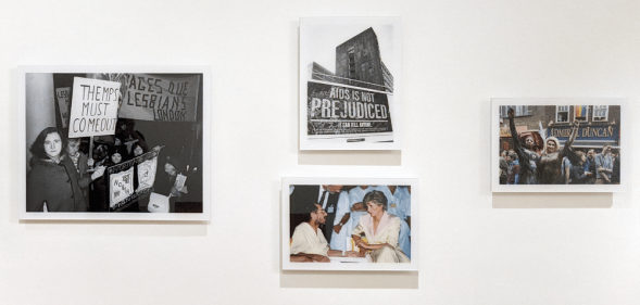 Four photos on a wall in Queer Britain, showing protestors, the Admiral Duncan LGBT+ pub, and Princess Diana meeting AIDS patients
