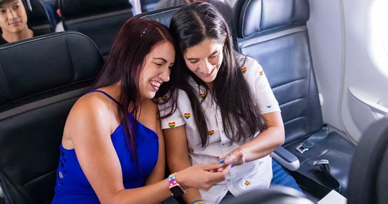 Veronica Rojas and Alejandra Moncayo sit together on Pride in the Sky