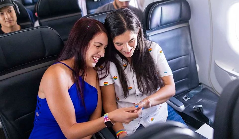 Veronica Rojas and Alejandra Moncayo sit together on Pride in the Sky
