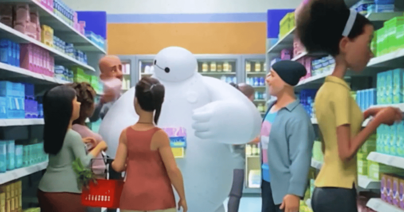 Baymax is surrounded by several people recommending period products