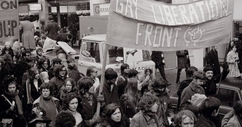 Members of the Gay Liberation Front marching in a historic picture.