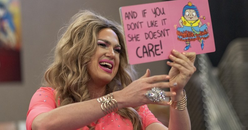 Drag queen Pickle reads from a book during a Drag Queen Story Hour event at the West Valley Regional Branch Library in Los Angeles, California