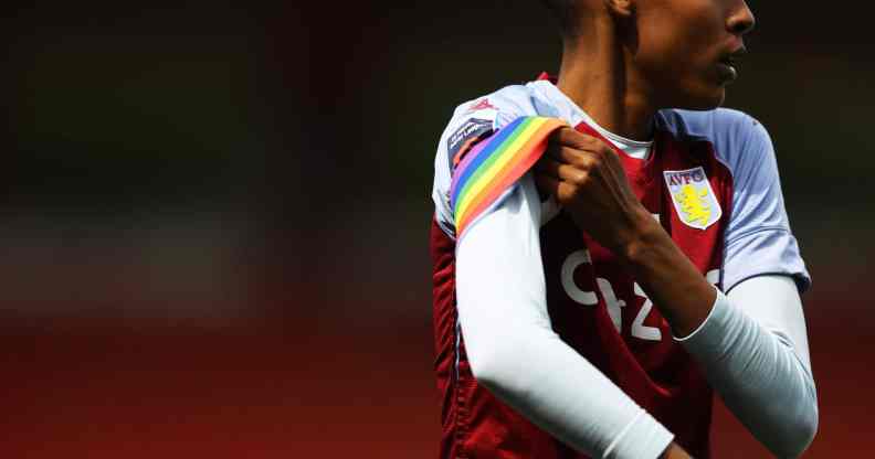 Elisha N'Dow of Aston Villa adjusts a rainbow armband