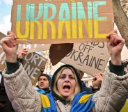 A Ukrainian person holds a sign reading "Ukraine" at a protest outside Downing Street against the recent invasion of Ukraine on February 24, 2022 in London, England.
