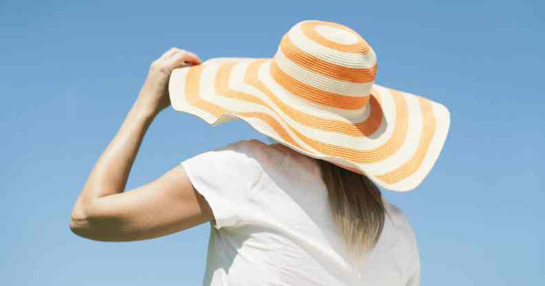 Woman wearing a sun hat looking away from the camera