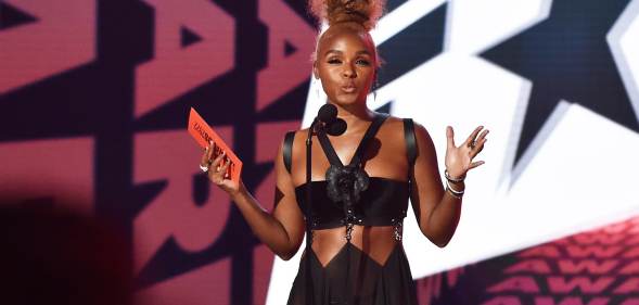 Janelle Monae wearing a strappy black dress