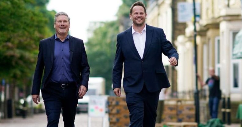 Labour leader Keir Starmer (L) and Simon Lightwood walking down a street