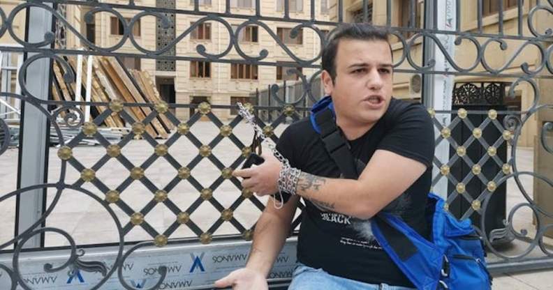 Avaz Hafizli chained to the gate of Azerbaijan's Prosecutor General’s Office