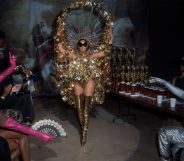 Beyoncé in a gold ballroom inspired outfit.