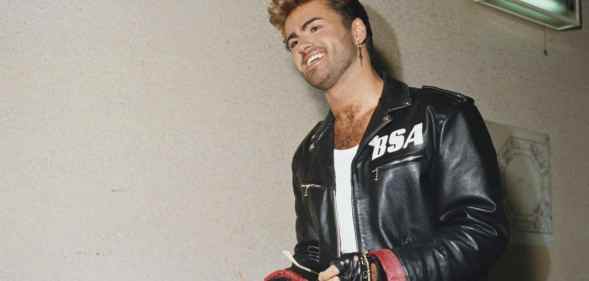 George Michael (1963-2016) pictured wearing a leather jacket with BSA logo backstage during the Japanese/Australasian leg of his Faith World Tour.