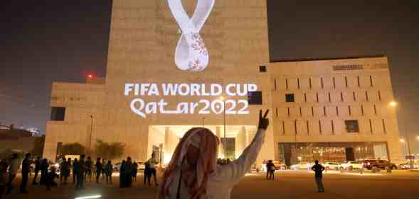 Fifa World Cup 2022 logo being projected on a building in Qatar
