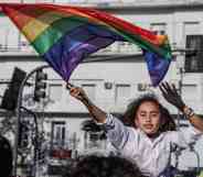 A reveller takes part in the 30th Pride Parade in Buenos Aires city, on November 6, 2021.