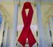 A large red ribbon is seen on the White House