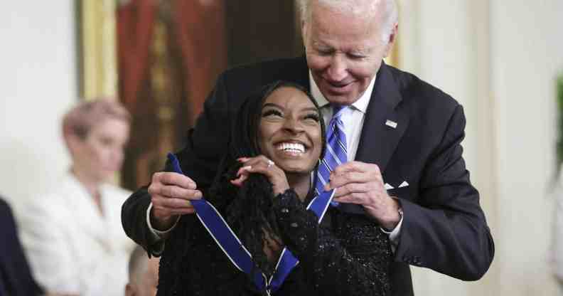 U.S. President Joe Biden presents the Presidential Medal of Freedom to Simone Biles, Olympic gold medal gymnast and mental health advocate, during a ceremony in the East Room of the White House July 7, 2022 in Washington, DC.