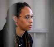 Brittney Griner sits in a prison cell
