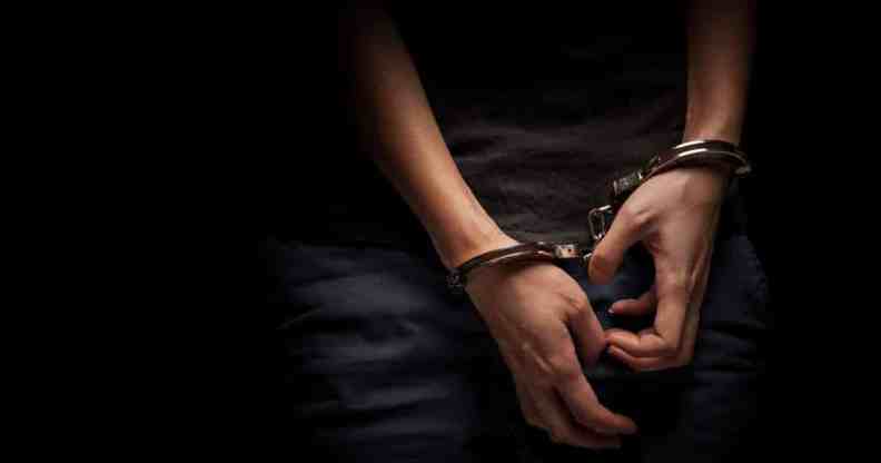 A teenagers hands in handcuffs