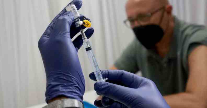 A healthcare worker prepares to administer a monkeypox vaccine in Florida