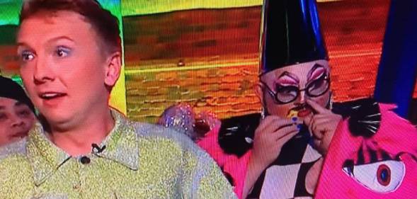 Drag queen Fatt Butcher wears a pink, black and white outfit as they sniff poppers during Joe Lycett's Big Pride Party on Channel 4