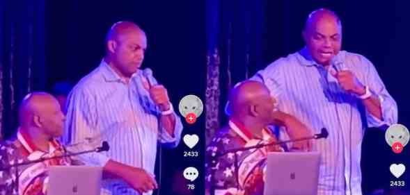 Charles Barkley holds a microphone on stage in Las Vegas
