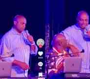 Charles Barkley holds a microphone on stage in Las Vegas