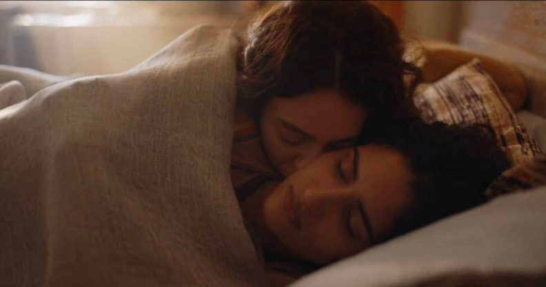 Tanya Reynolds and Seyan Servan as Helen and Nour in The Baby in bed together. (HBO/Sky)