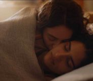 Tanya Reynolds and Seyan Servan as Helen and Nour in The Baby in bed together. (HBO/Sky)