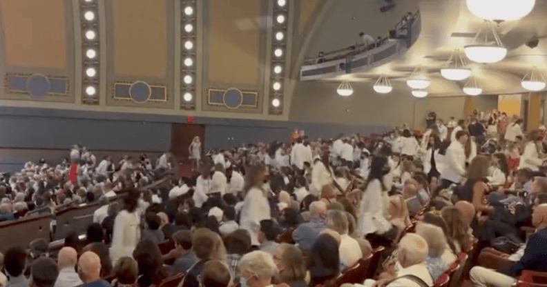 Students at the University of Michigan walk out of the white coat ceremony