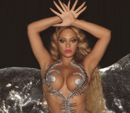 Beyonce with her hands above her head