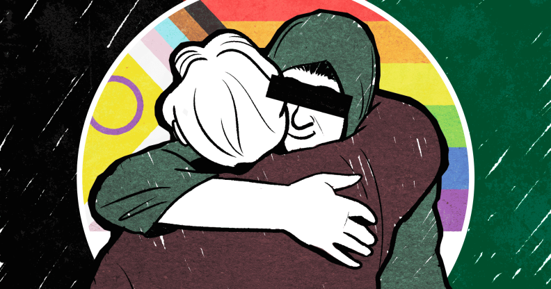 Two people are shown hugging against a progress Pride flag in an animation.