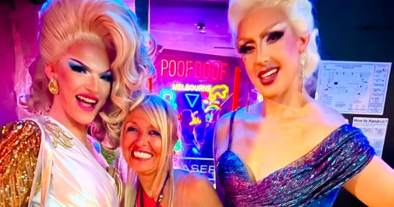 In this photograph, Martha Tsamis poses with two drag queens either side of her