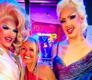 In this photograph, Martha Tsamis poses with two drag queens either side of her