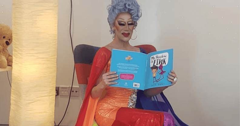 Cherrie Ontop reading a story book at story time event