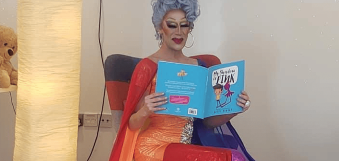 Cherrie Ontop reading a story book at story time event