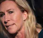 Marjorie Taylor Greene stares into the camera