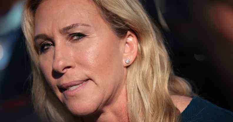 Marjorie Taylor Greene stares into the camera