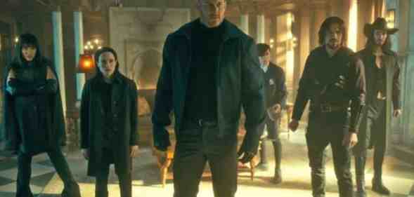 The cast of the Umbrella Academy stand together on set