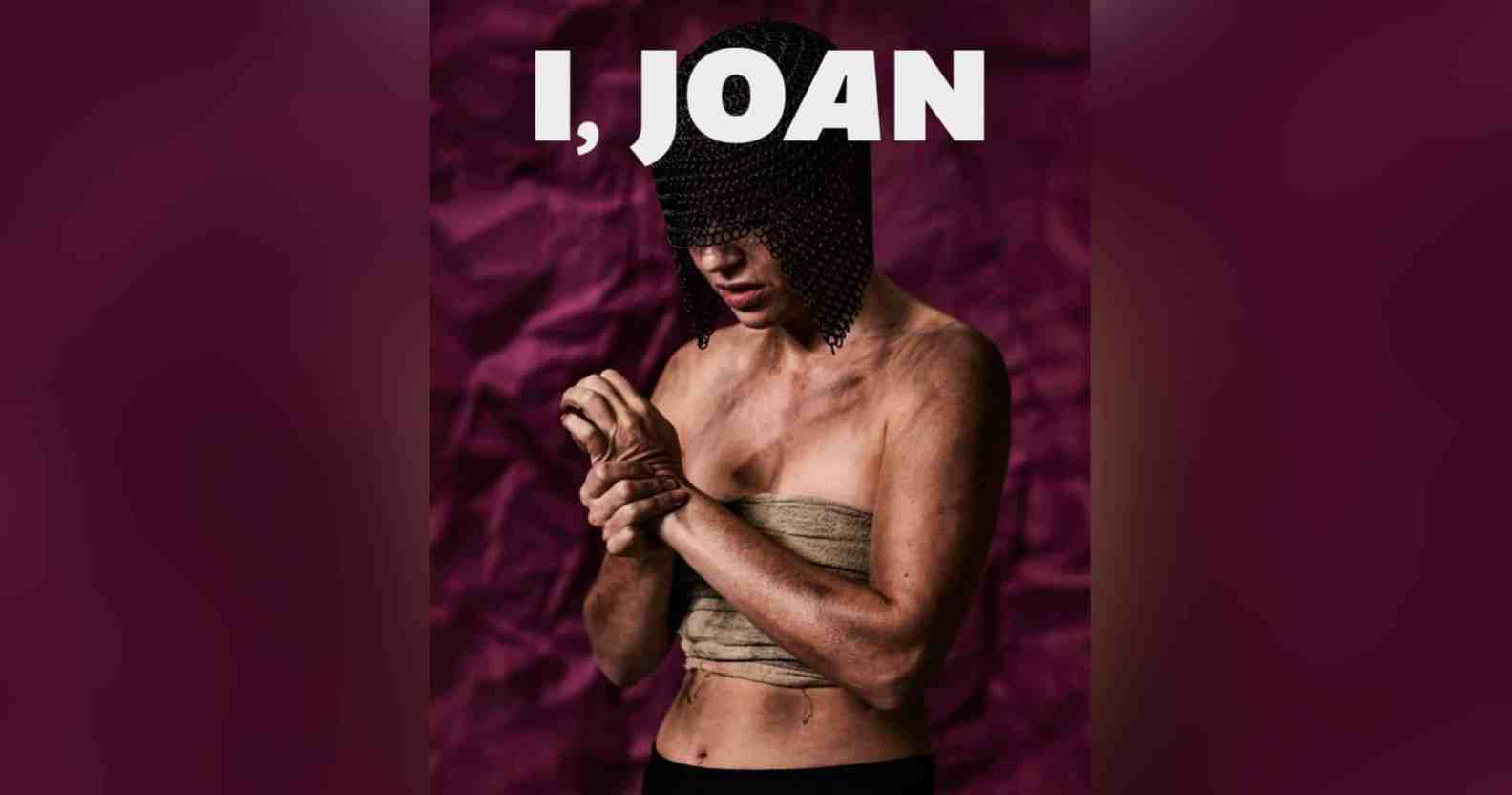 A graphic of a person who is covered in dirt and grime, their chest is bound and they wring their hands. A chainmail helmet covers their eyes. They stand in front of a purple background with text above their head reading I, JOAN in large white letters.