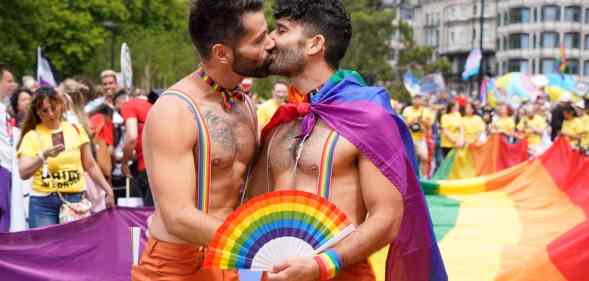 Two men share a kiss at London Pride