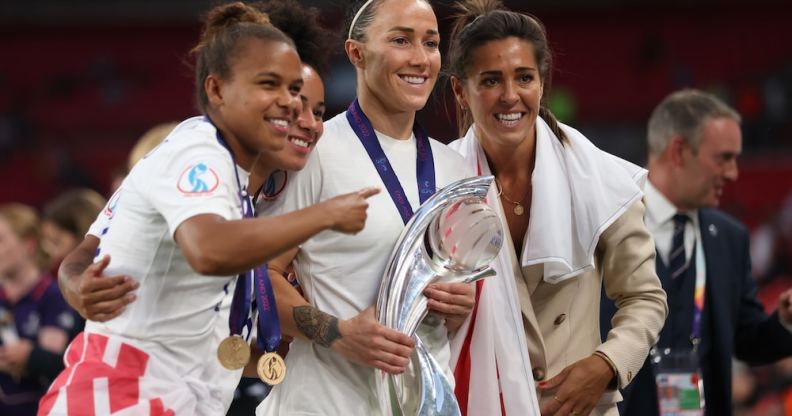 Lionesses Nikita Parris, Demi Stokes, Lucy Bronze and Fara Williams pose with the trophy after the UEFA Women's Euro England 2022 final match between England and Germany