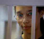 Brittney Griner looks out of a jail cell