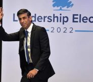 In this photograph, Rishi Sunak waves as he walks across the stage the the Conservative leadership hustings in Perth, Scotland