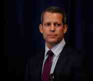 In this photograph, Andrew Warren holds a press conference