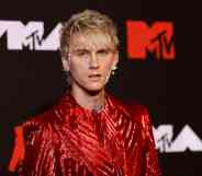 Machine Gun Kelly reacts after vandals spray-paint the wrong bus with homophobic graffiti