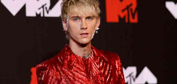 Machine Gun Kelly reacts after vandals spray-paint the wrong bus with homophobic graffiti