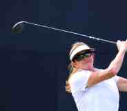 In this photograph, Caitlyn Jenner swings a golf bat